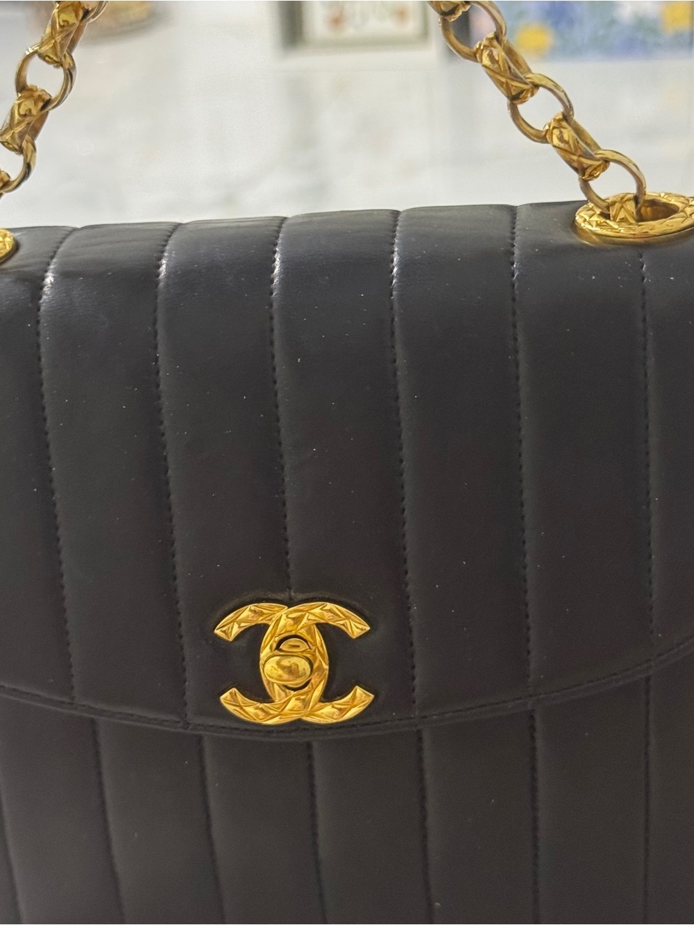 CHANEL Black Vertical Quilted Lambskin Shoulder Bag with Gold Hardware